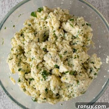 Ricotta-Stuffed Pasta Shells Recipe 10 Lumpy ricotta cheese mixture with flecks of green through it.