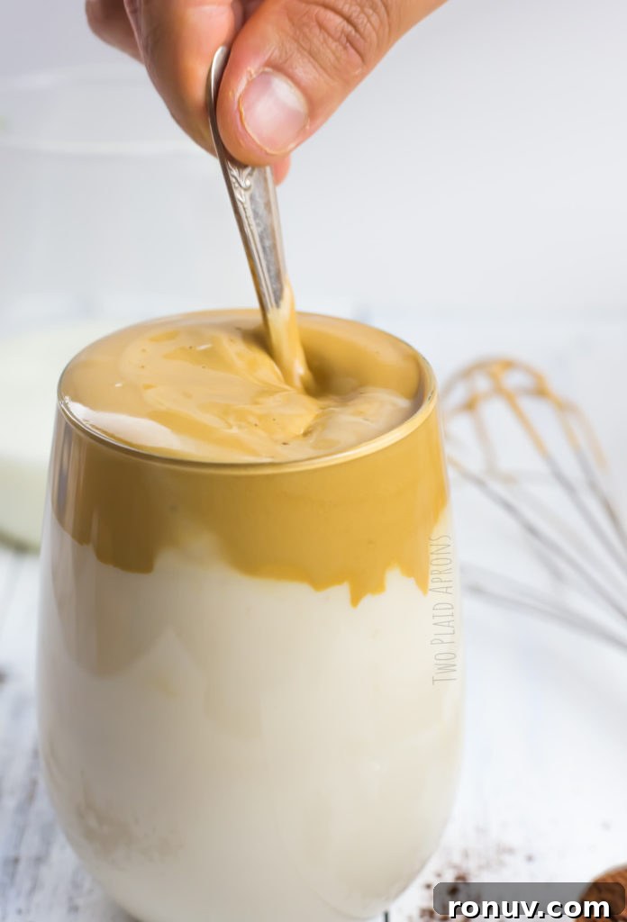 Dalgona Coffee Recipe: Whipped Coffee at Home 3 Stirring the coffee.