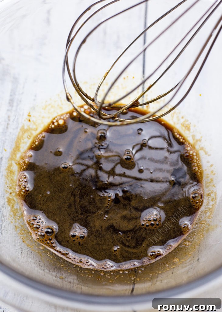 Dalgona Coffee Recipe: Whipped Coffee at Home 6 Whisking the coffee mixture to dissolve.