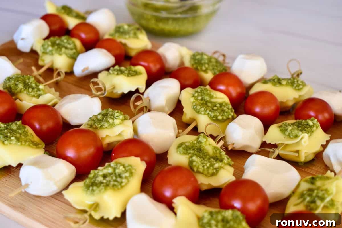 Make-Ahead Baby Shower Recipes and Party Food Ideas 19 Pesto Tortellini Skewers.