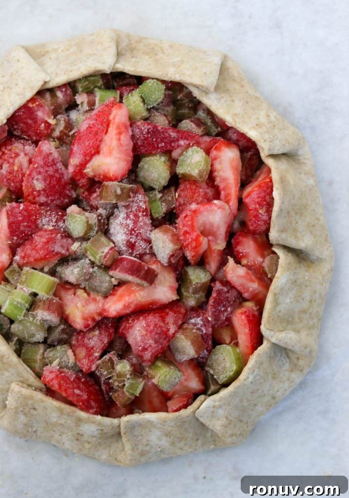 Rustic Strawberry Rhubarb Galette with Rye Crust 7 Unbaked galette filled with strawberries and rhubarb