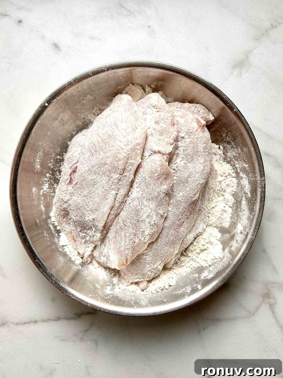 Creamy Tuscan Chicken Recipe with Spinach and Sun Dried Tomatoes 4 coating chicken breasts in flour, salt, and pepper.