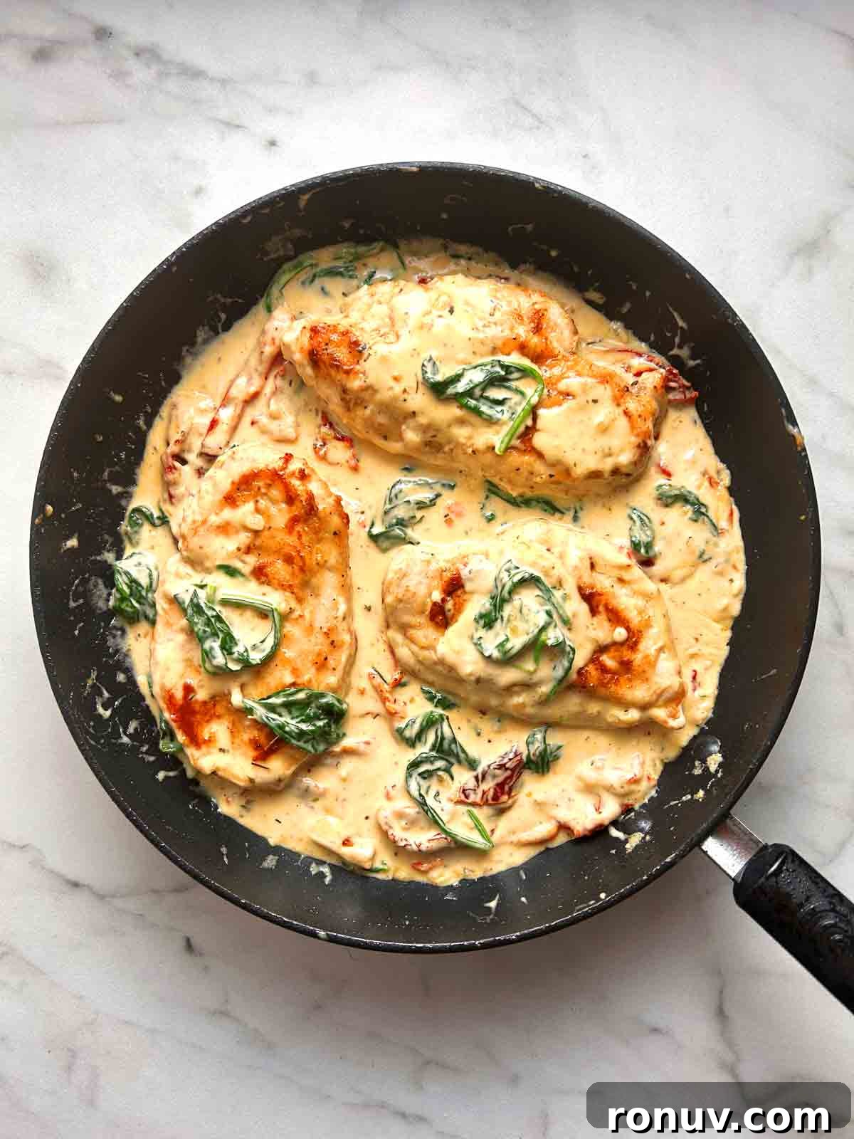 Creamy Tuscan Chicken Recipe with Spinach and Sun Dried Tomatoes 7 tuscan chicken in pan.