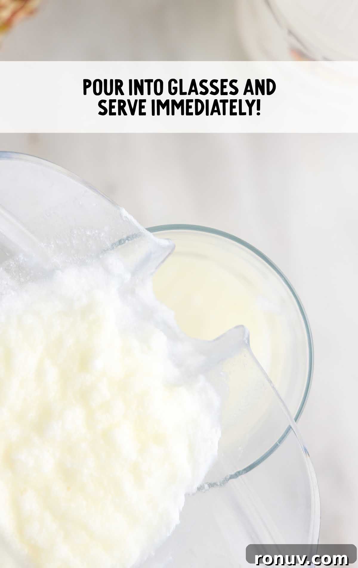 Classic Piña Colada Cocktail Recipe 5 Pina Colada being poured from a blender into a glass