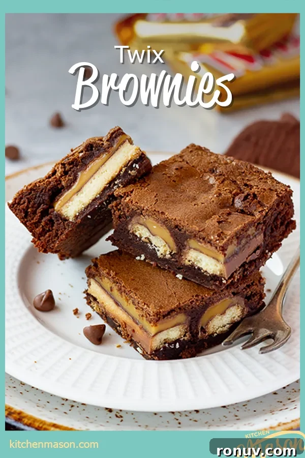 Homemade Fudgy Twix Brownies Recipe 18 3 Twix brownies and a fork stacked on a white ribbed plate.