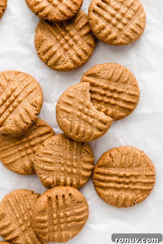 Chewy Vegan Peanut Butter Cookies Recipe 8 vegan peanut butter cookies on parchment paper