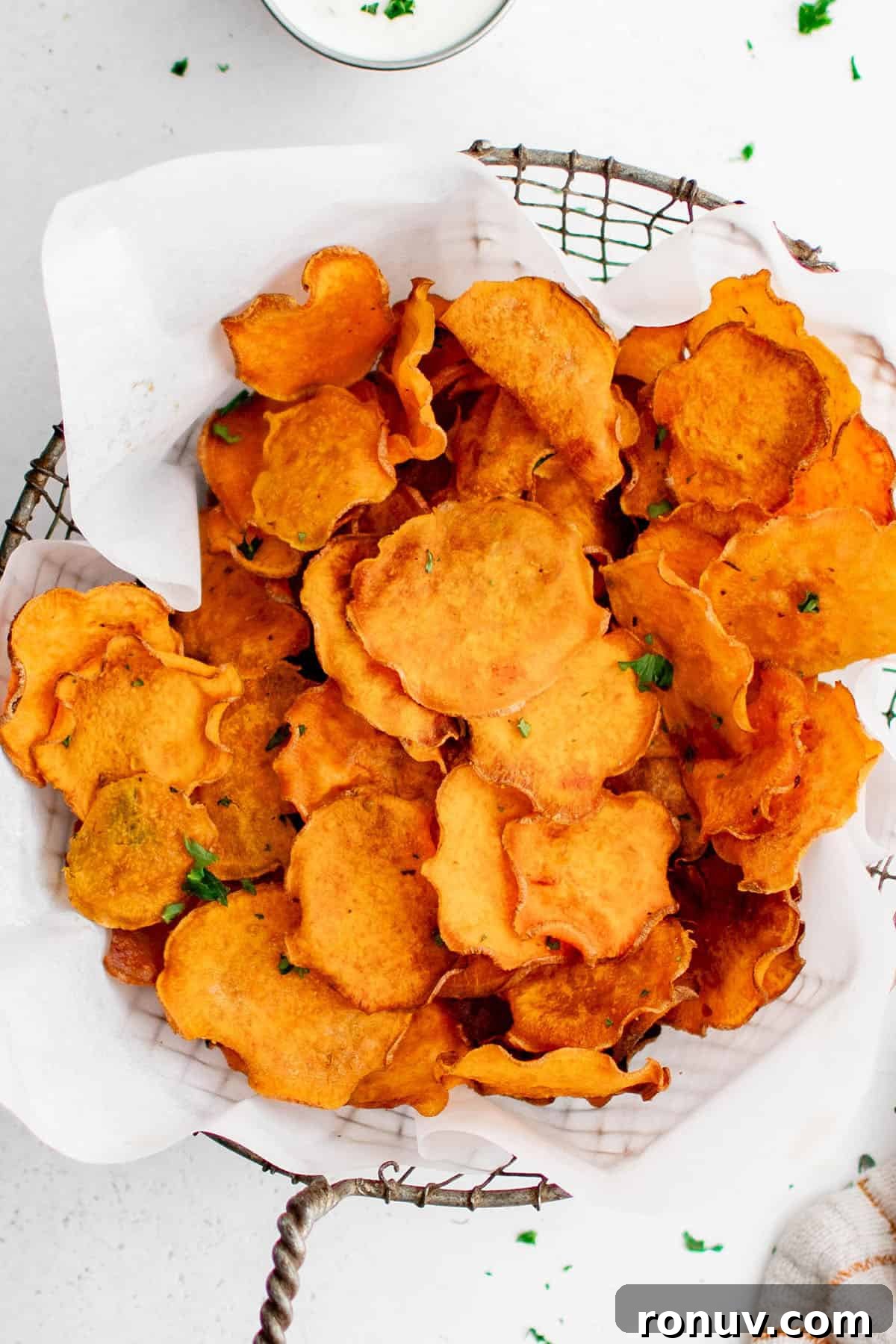 How to Make Crispy Sweet Potato Chips at Home 4 sweet potato chips in a basket