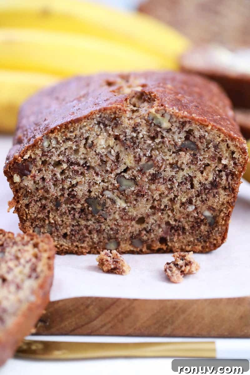 Moist Banana Nut Bread Recipe with Walnuts 8 closeup of banana nut bead sliced