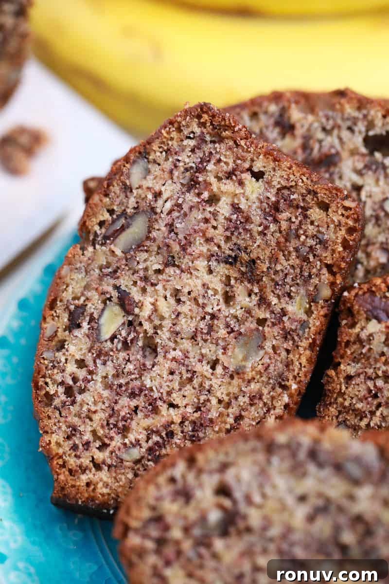 Moist Banana Nut Bread Recipe with Walnuts 9 close up of sliced banana nut bread