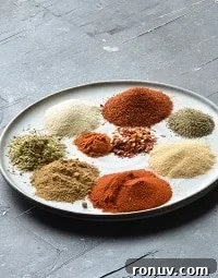 Homemade Salt-Free Fajita Seasoning Recipe 7 fajita seasoning spices in a beige plate