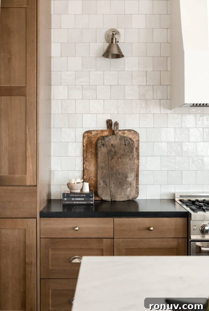Granite Countertops: Pros, Cons, and Cost Guide 3 Vintage cutting boards in dream kitchen interior design by Boxwood Avenue Interiors with white oak cabinets Cloe backsplash and marble countertops.