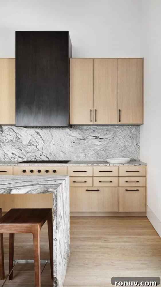 Granite Countertops: Pros, Cons, and Cost Guide 5 modern wood tone kitchen with a black metal hood with black and white swirled granite countertops