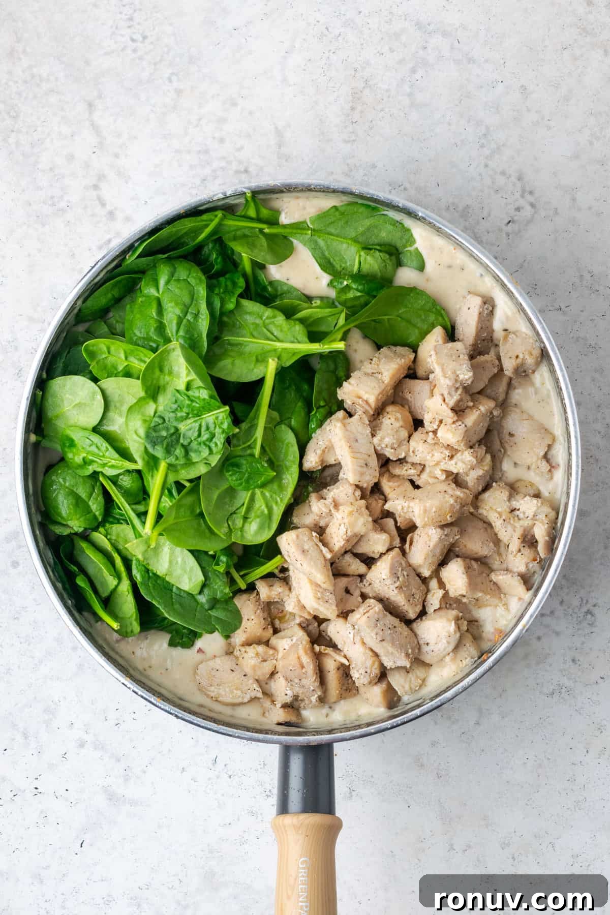 30-Minute Creamy Marry Me Chicken Pasta Recipe 12 Baby spinach and cooked chicken added to the pot with the Parmesan sauce.