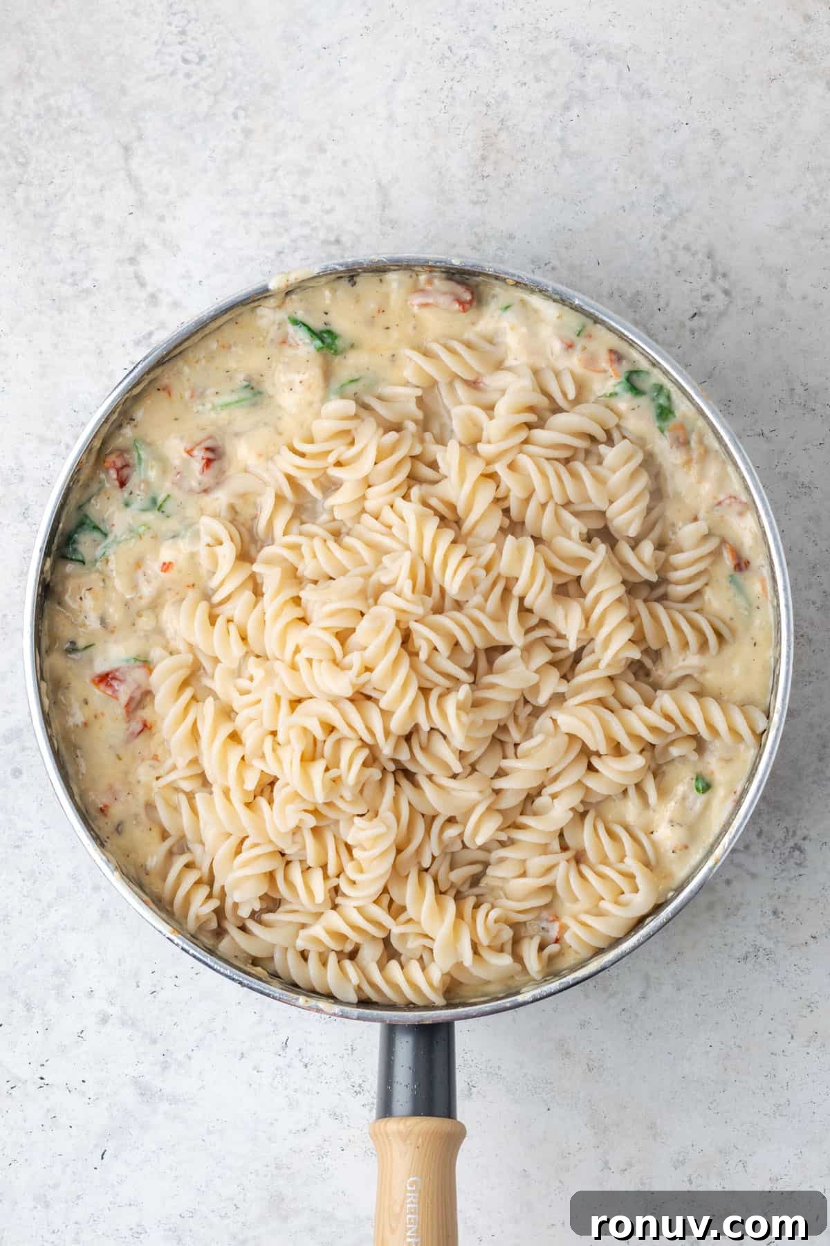 30-Minute Creamy Marry Me Chicken Pasta Recipe 13 Cooked pasta added to the saute pan with the chicken and sauce.