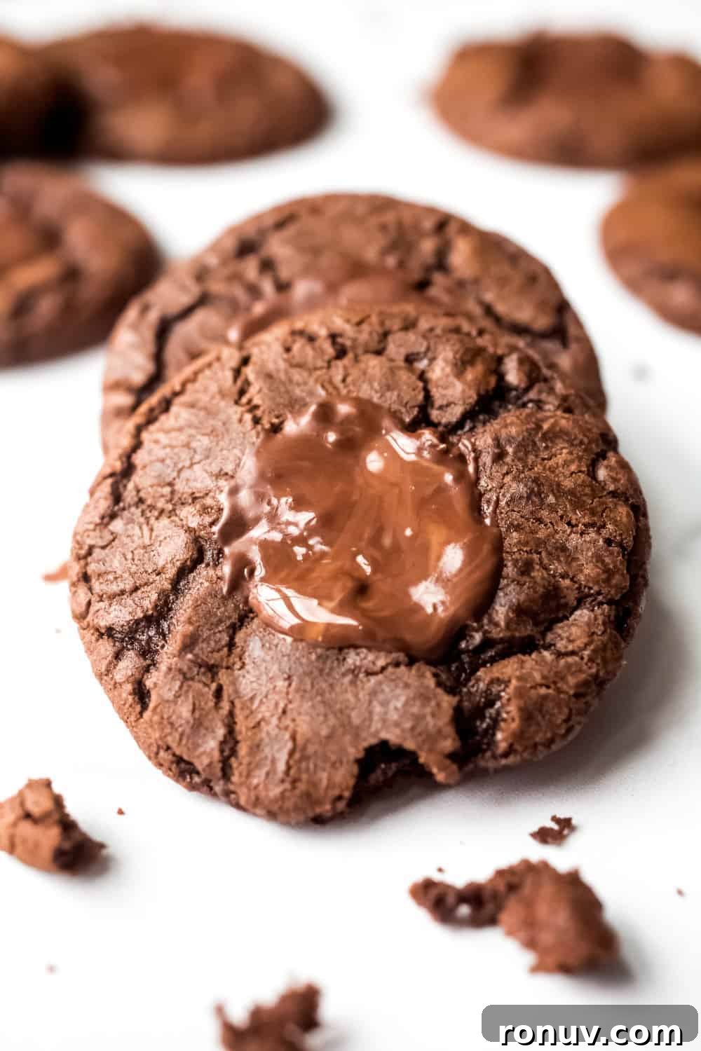 Close up of a mint chocolate cookie with melted mint chocolate candy on top