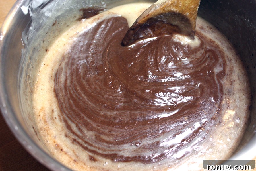 No-Bake Chocolate Peppermint Fudge Recipe 3 Fudge ingredients cooking in a sauce pan.