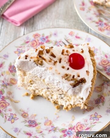 No-Bake Peanut Butter Caramel Cheesecake Pie Recipe 6 A slice of creamy Million Dollar Pie on a plate.
