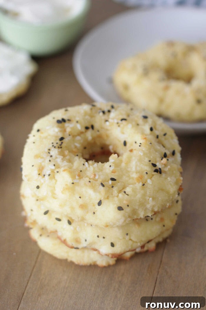Low-Carb Bagels stacked on a light wooden board
