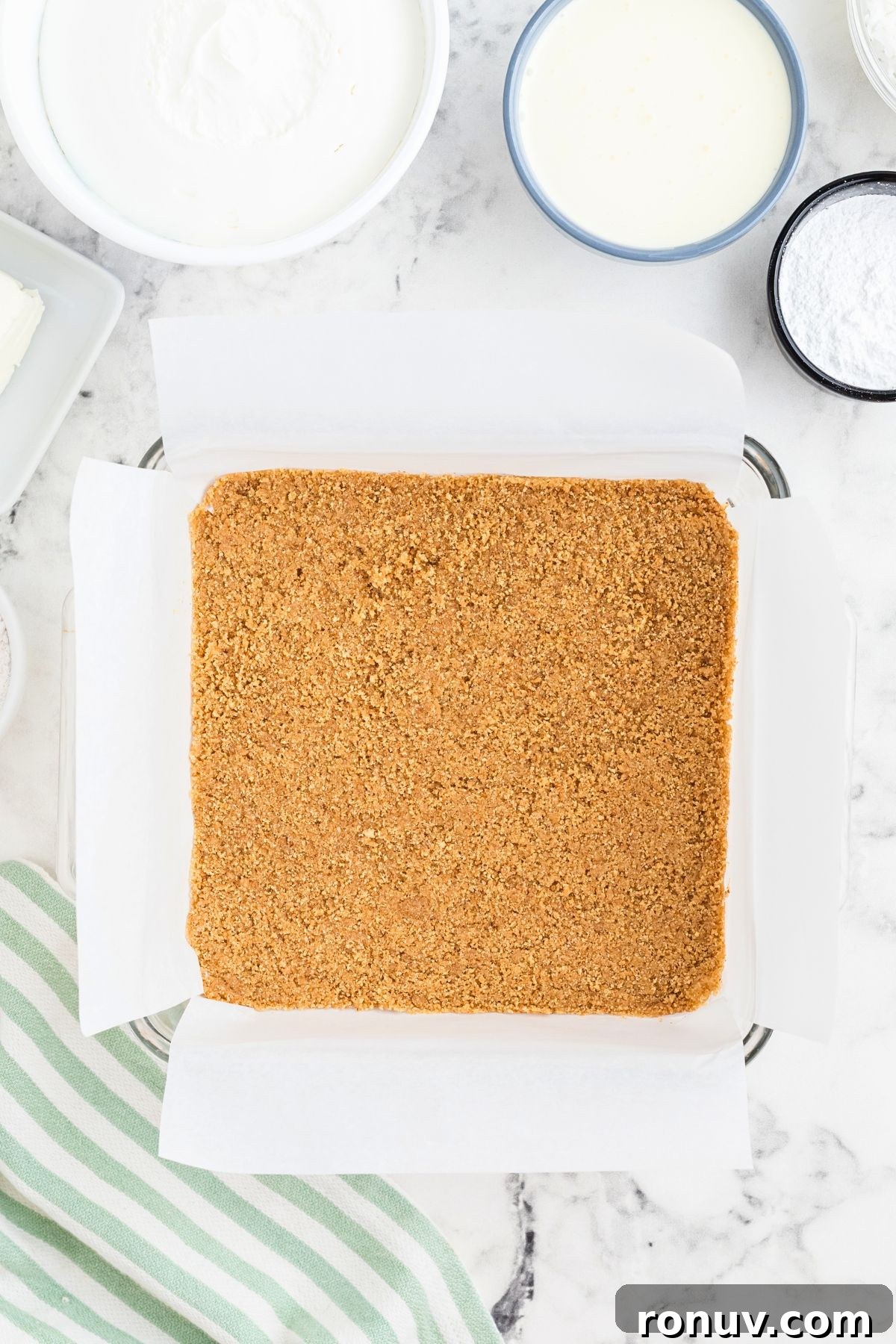 Homemade Coconut Delight Dessert Recipe 5 Graham crack crust crushed and mixed with melted butter pressed into baking dish.