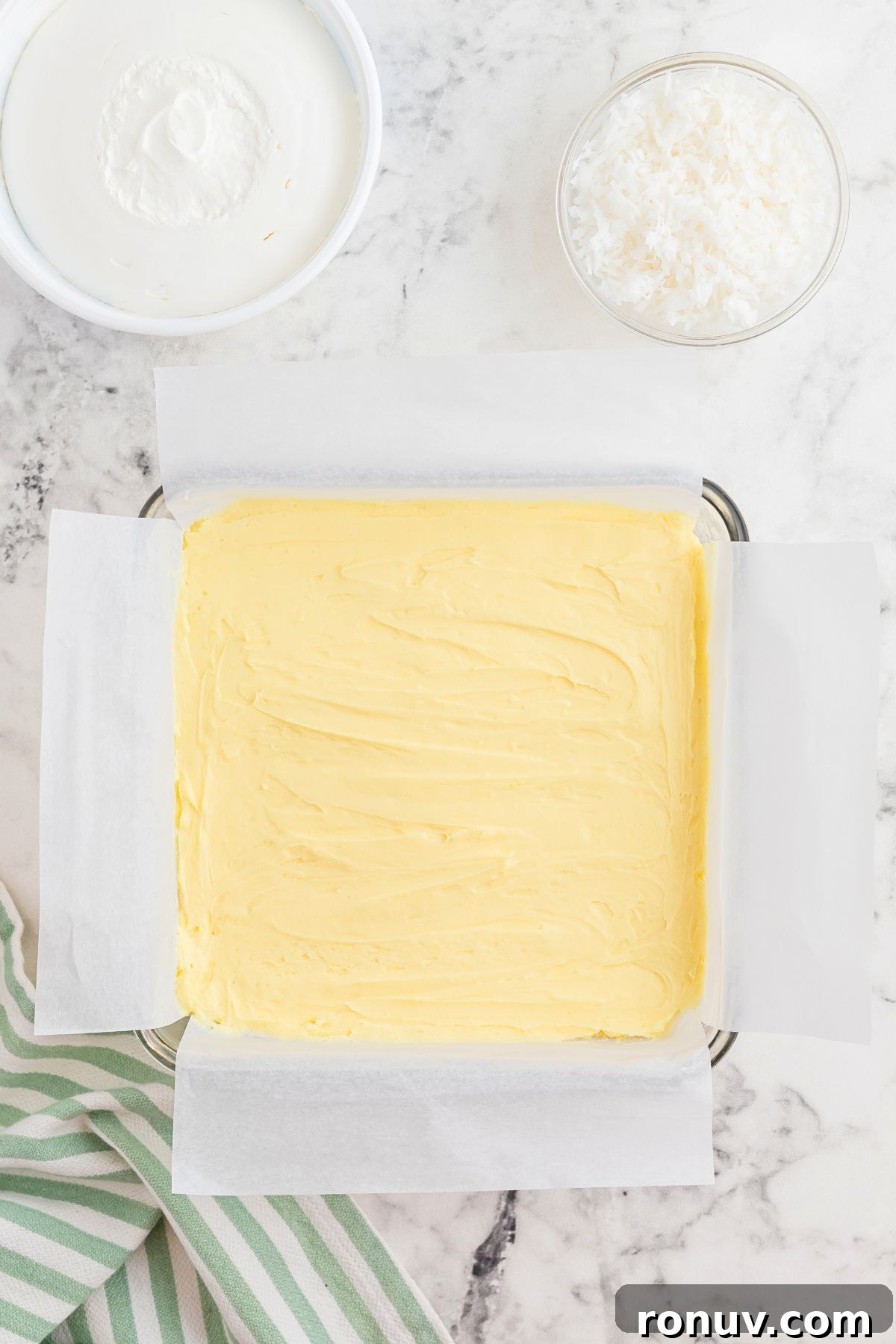 Homemade Coconut Delight Dessert Recipe 6 Cream cheese cheesecake mixture spread over graham cracker crust.