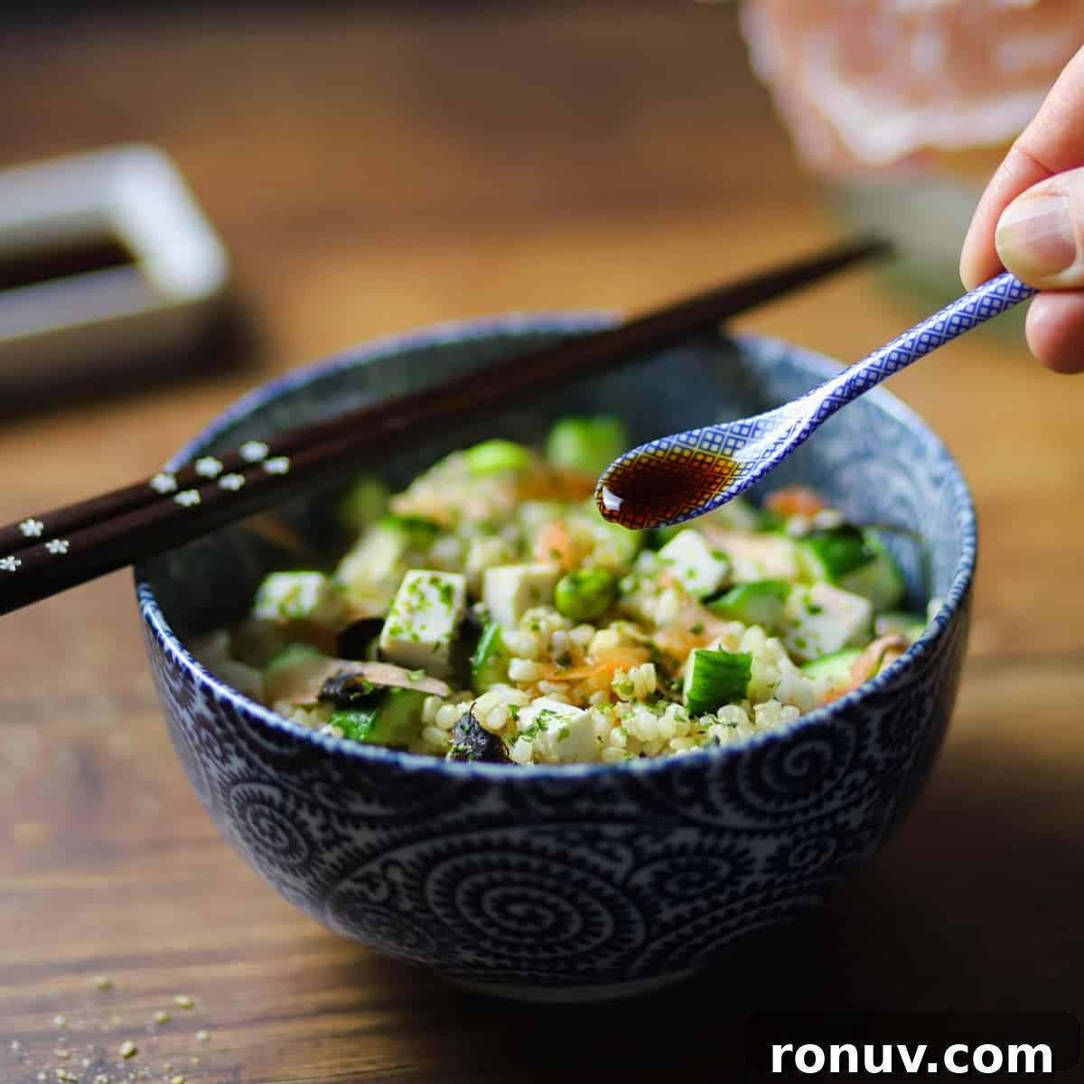 photo of a bowl of brown sushi rice with vegan sushi toppings