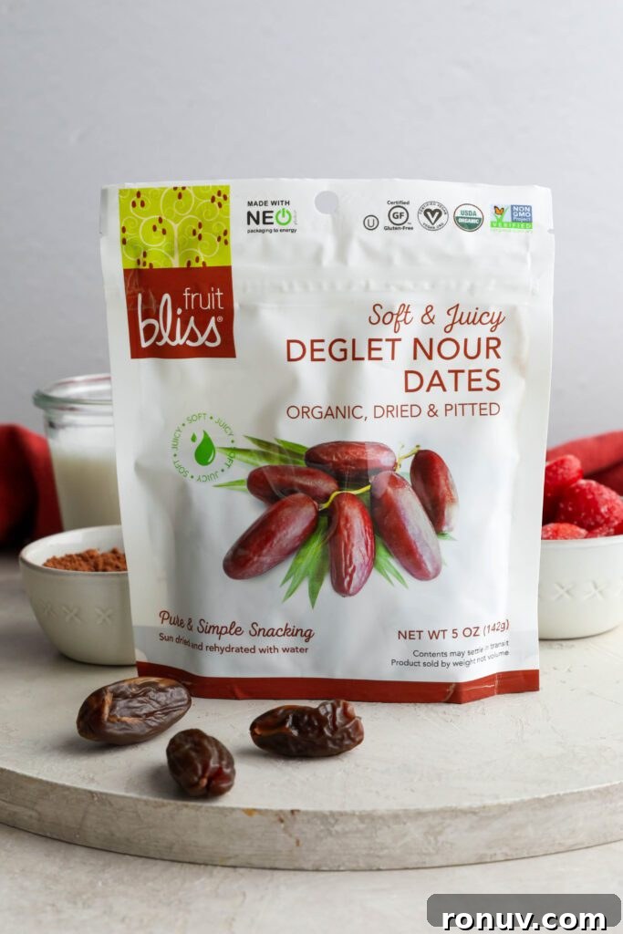 Creamy Red Velvet Protein Shake Recipe 4 Fruit Bliss Deglet Nour Dates packaging on board with Medjool dates on Flora & Vino