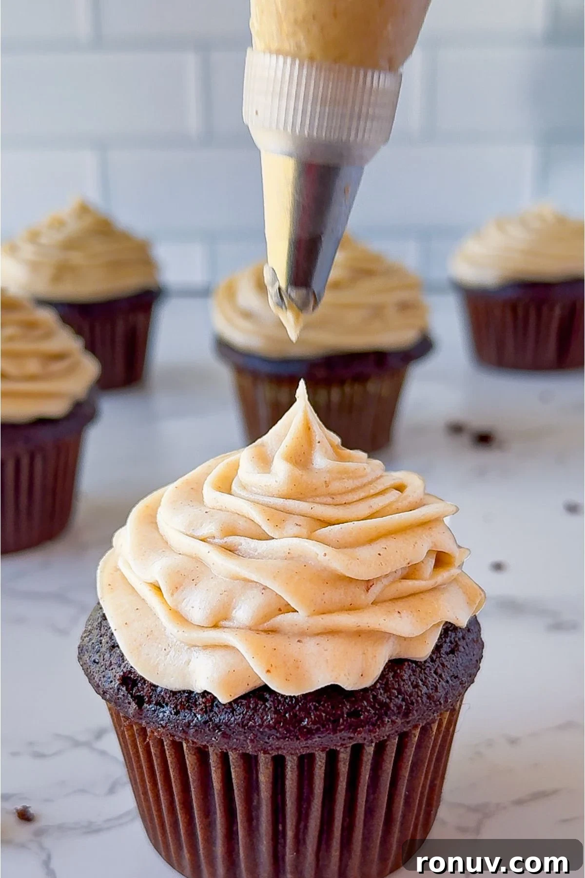 Brown Butter Cream Cheese Frosting on a cupcake.