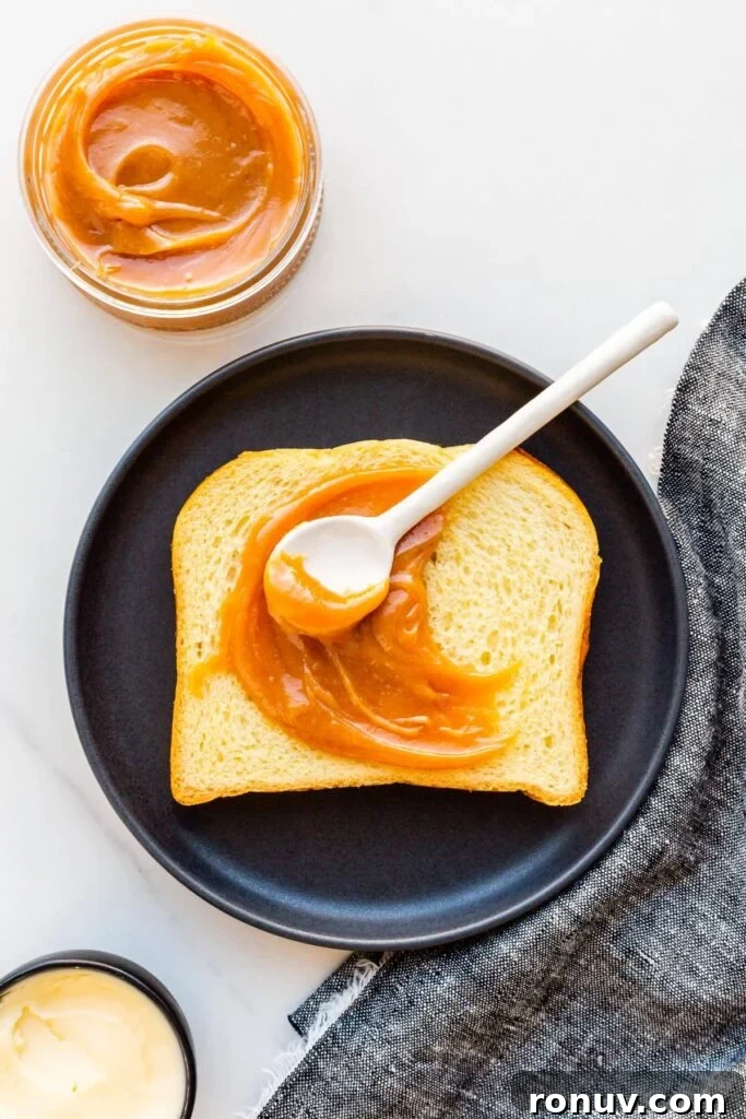 How to Make Dulce de Leche at Home 4 A slice of brioche with homemade dulce de leche smeared on it.