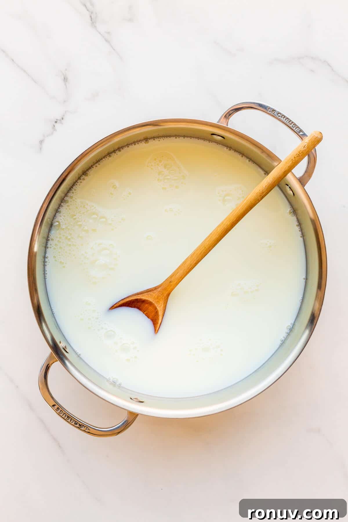 How to Make Dulce de Leche at Home 5 A pot of milk and sugar ready to be cooked to make milk jam or dulce de leche.