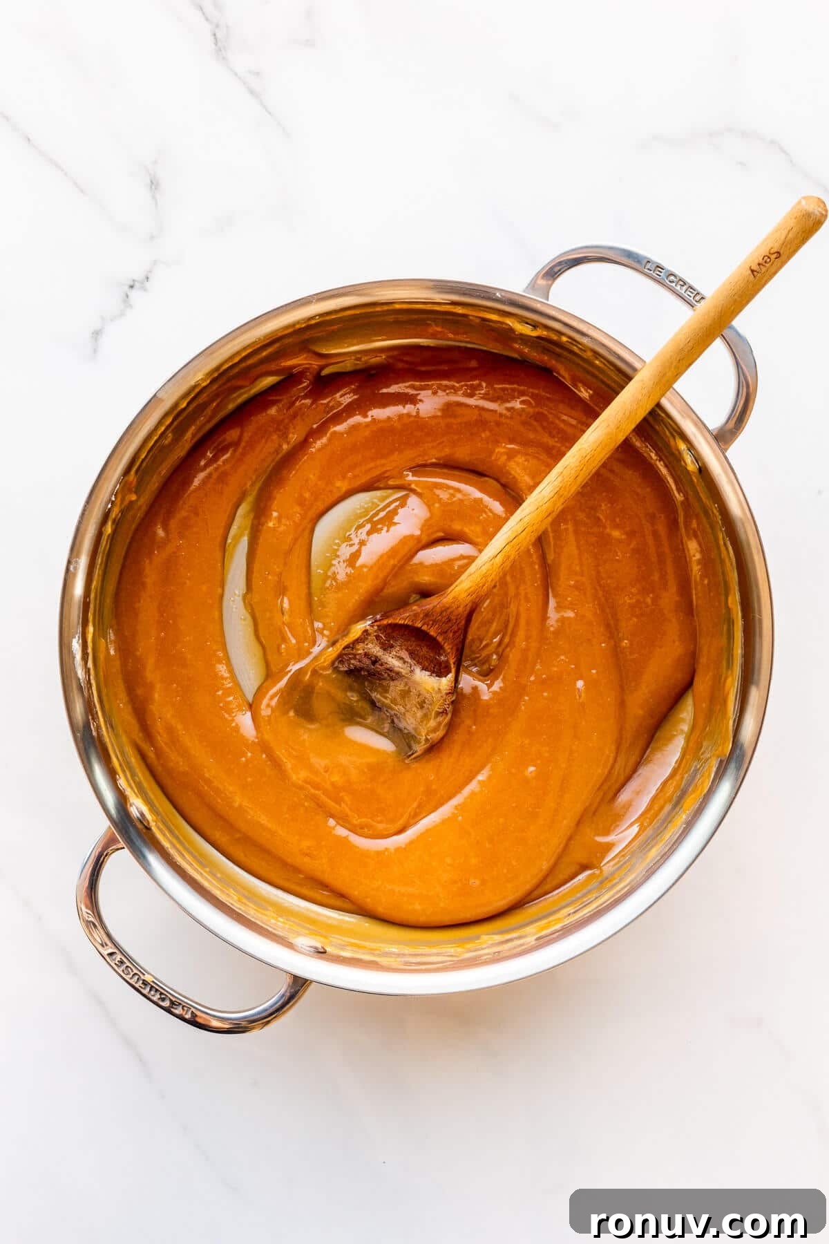 How to Make Dulce de Leche at Home 6 A pot of homemade dulce de leche freshly made and ready to transfer to a jar.