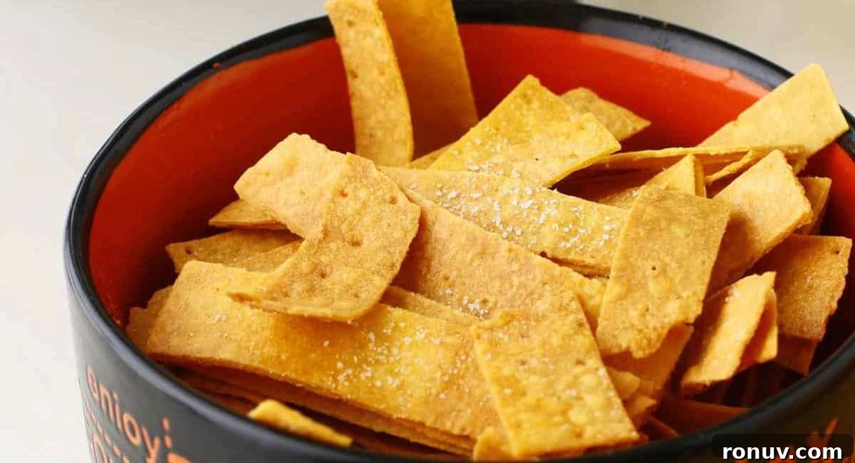What to Serve with Taco Soup: 20 Toppings and Sides 4 Up close image of air fryer tortilla strips in red and black bowl.