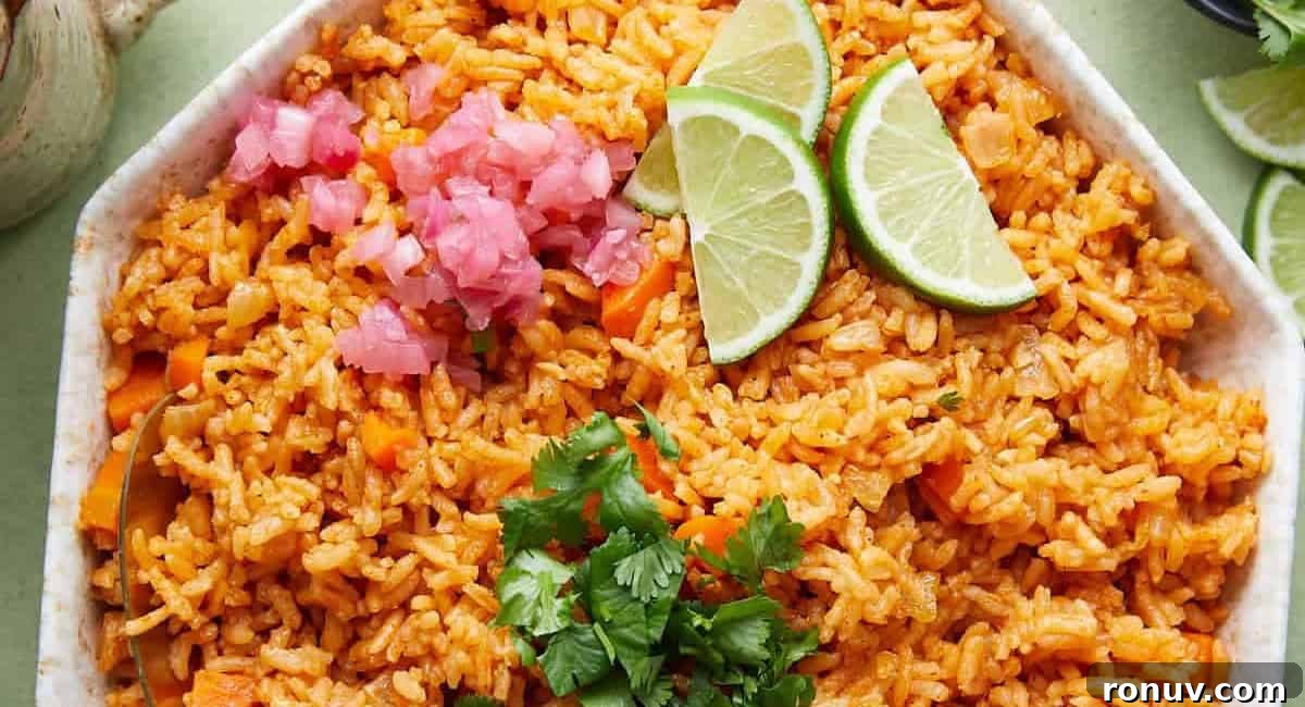 What to Serve with Taco Soup: 20 Toppings and Sides 9 Overhead image of Mexican red rice with garnish.