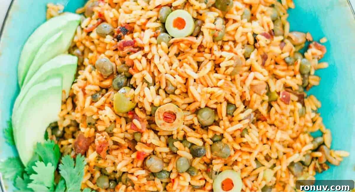 What to Serve with Taco Soup: 20 Toppings and Sides 10 Overhead image of Puerto Rican rice with pegeon peas on blue dish.