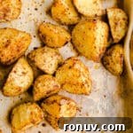 20 Creative Sides to Serve with Soup Beyond Bread 11 Seasoned potato chunks on a sheet pan.