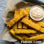 20 Creative Sides to Serve with Soup Beyond Bread 15 Crispy polenta fries in a blue dish on a blue tablecloth.