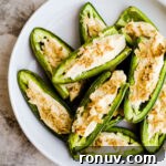20 Creative Sides to Serve with Soup Beyond Bread 18 Jalapeños with cream cheese and crushed potato chips on a white plate.
