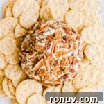 20 Creative Sides to Serve with Soup Beyond Bread 19 A cheese ball with pecans surrounded by crackers.