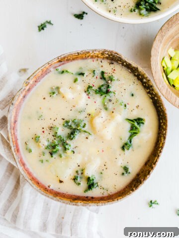 potato soup in bowl with kale