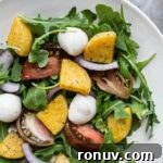 20 Creative Sides to Serve with Soup Beyond Bread 4 Arugula salad with polenta in a white bowl.