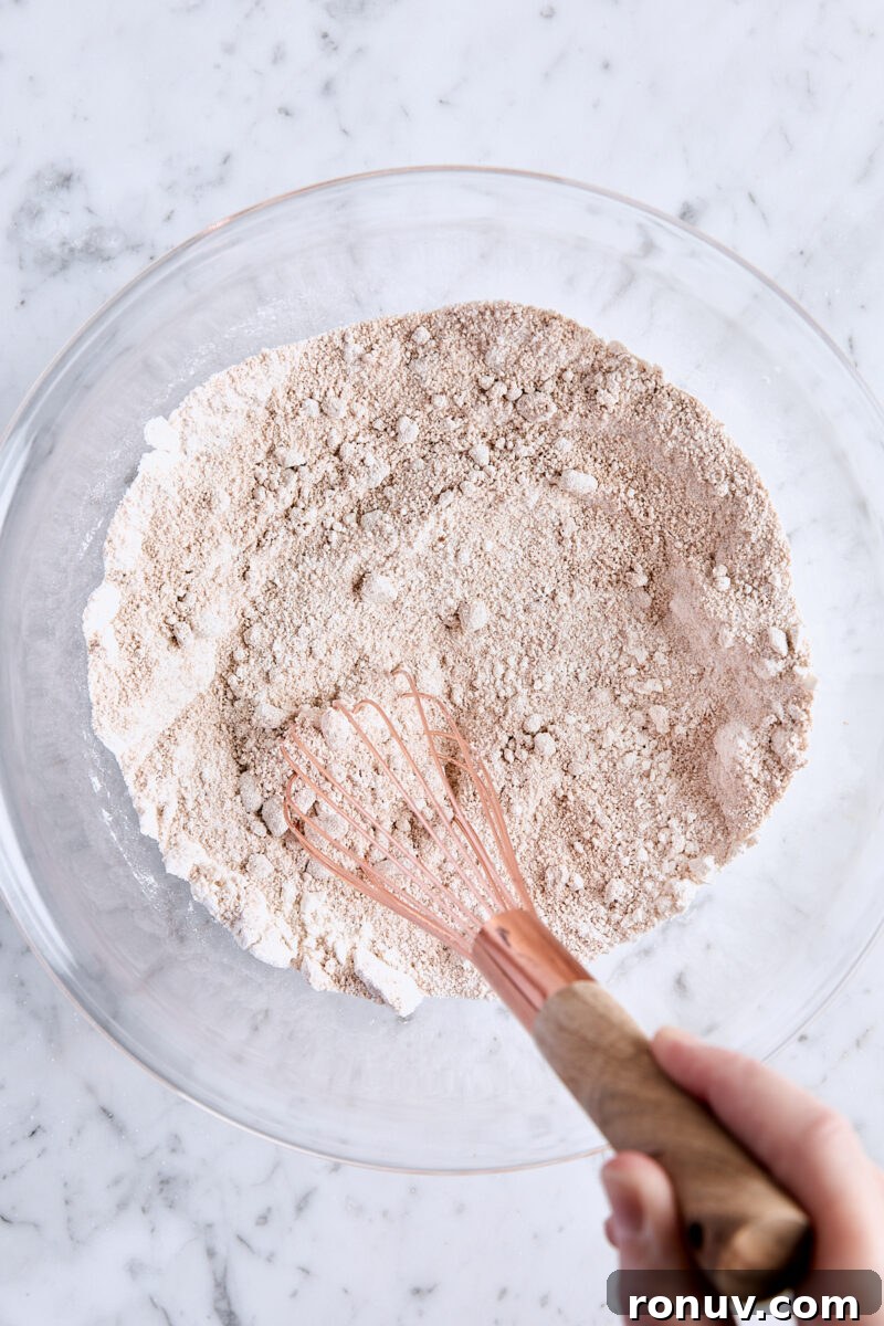 Moist Sour Cream Coffee Cake Recipe with Cinnamon Streusel 5 All-purpose flour, granulated sugar, brown sugar, cinnamon, and salt whisked together in glass bowl