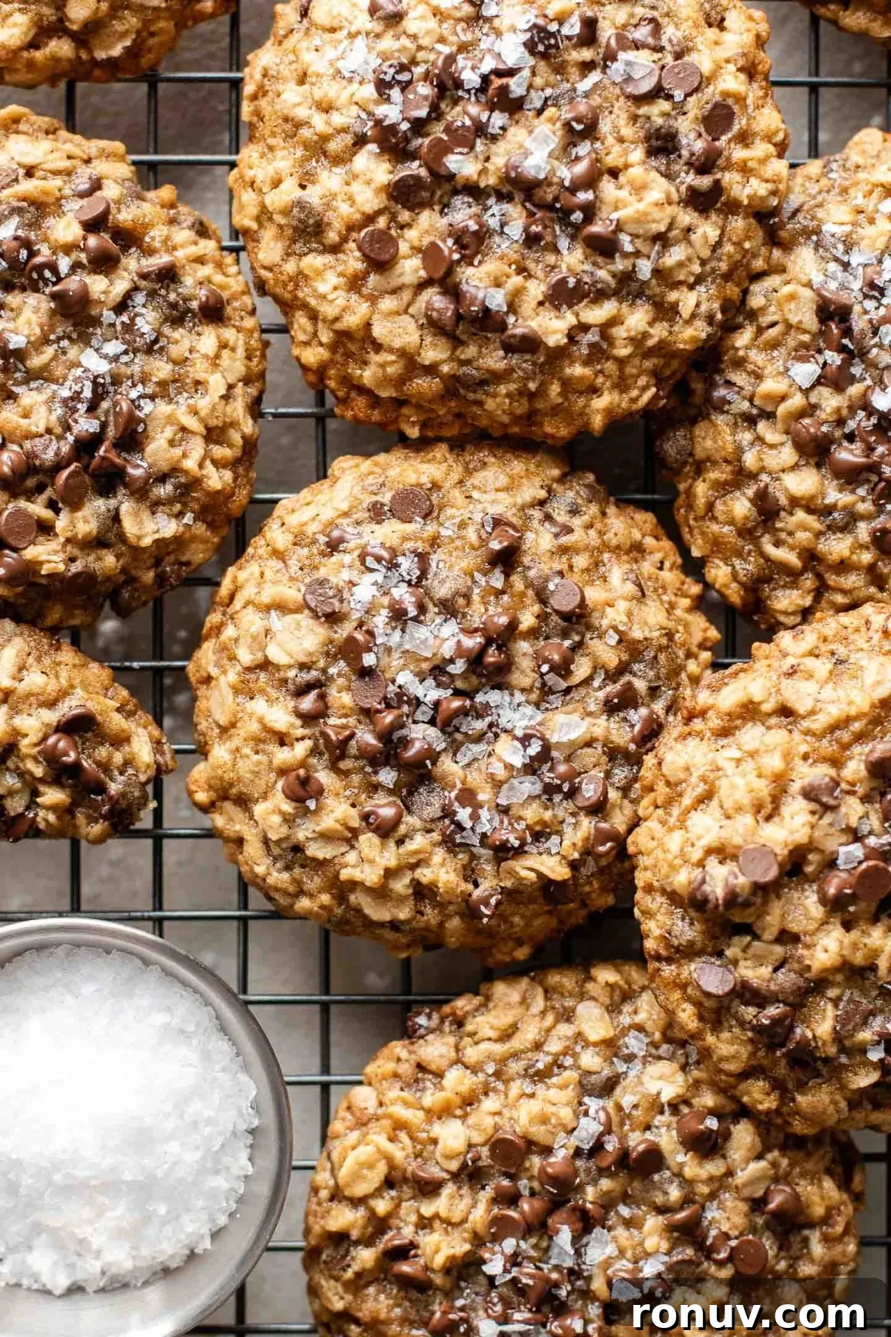 Soft Chewy Oatmeal Chocolate Chip Cookies 2 oatmeal chocolate chip cookies on wire rack