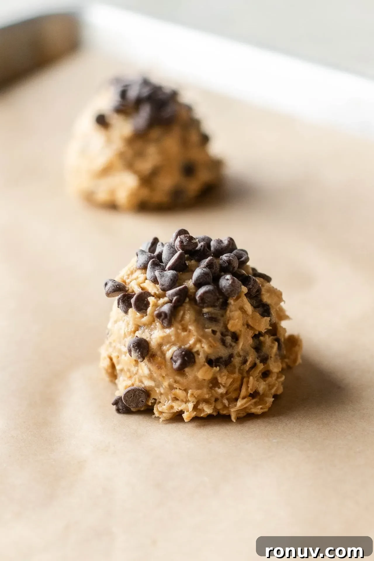 Soft Chewy Oatmeal Chocolate Chip Cookies 6 oatmeal chocolate chip cookie dough scooped onto parchment lined baking sheet