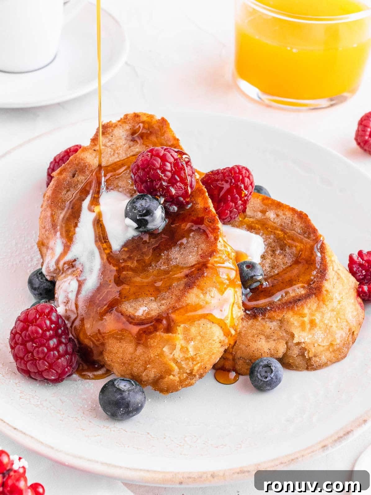 Vegan French Toast Recipe with Cinnamon Maple Syrup 2 vegan French toast with berries and syrup drizzle