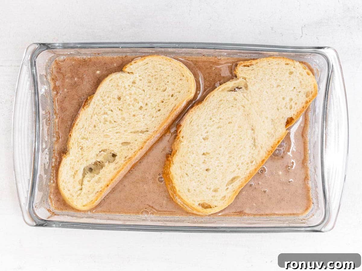 Vegan French Toast Recipe with Cinnamon Maple Syrup 9 slices of bread soaking in a batter