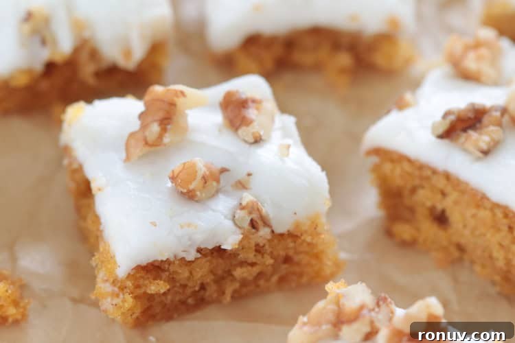 25 Easter Desserts to Impress Your Guests 14 carrot cake bars on parchment paper