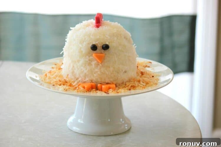 25 Easter Desserts to Impress Your Guests 22 chicken cake on white cake platter
