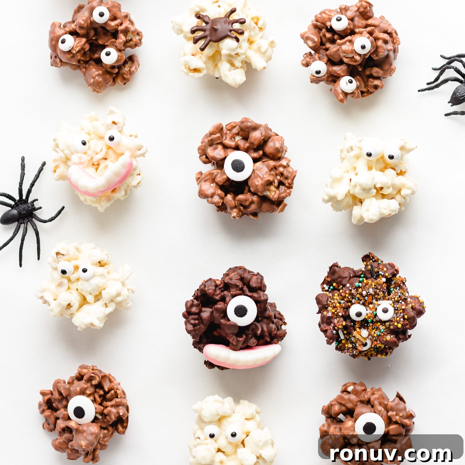 How to Make Chocolate Halloween Popcorn Balls 3 A variety of different chocolate popcorn balls decorated for Halloween.