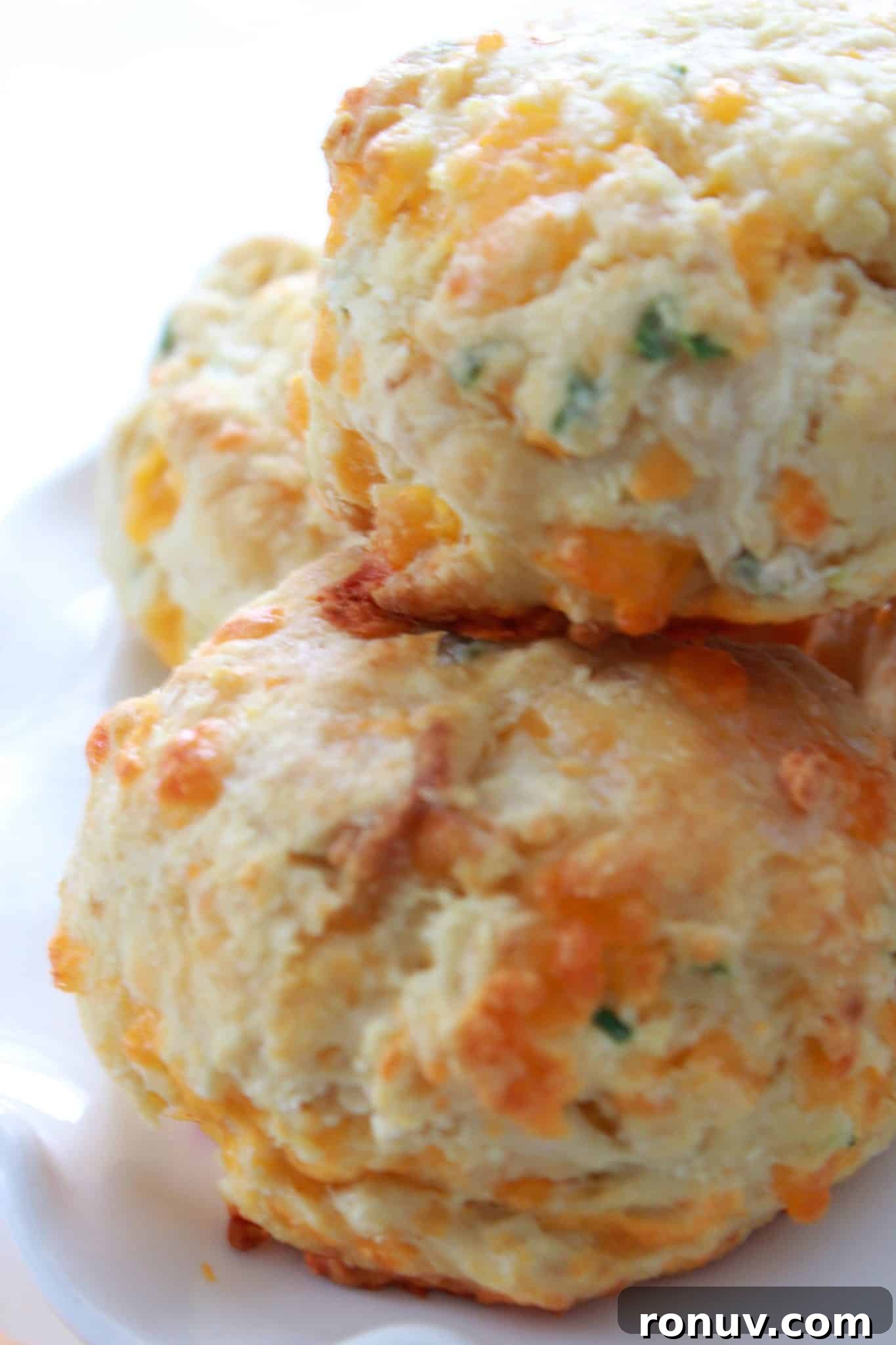 Mini Cheddar and Chive Irish Soda Bread Recipe 9 Cheddar and chive soda bread on a tray for serving.