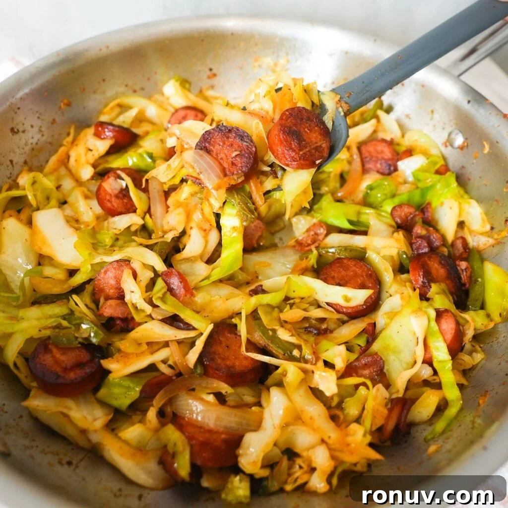 Southern Fried Cabbage Recipe with Bacon and Onions 2 Southern fried cabbage with bacon, sausage, and onions, cooked until tender and full of Cajun flavor.