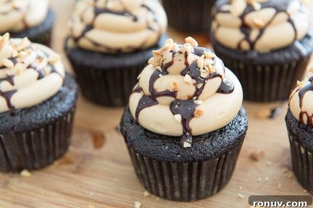 Chocolate Peanut Butter Cupcakes Recipe 3 Chocolate Cupcake Recipe - with Peanut Butter Frosting on Top of Wood Board